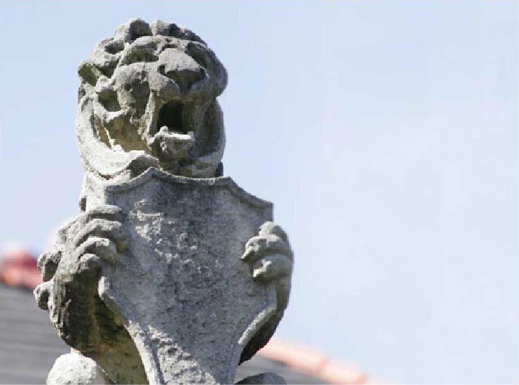 Statue of Lion Holding Tulane Shield - The Murphy Institute