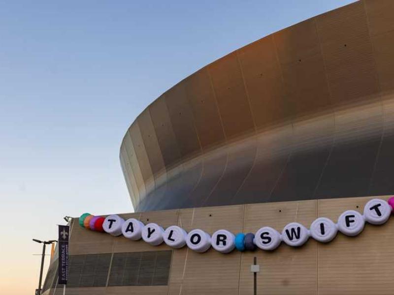 exterior of New Orleans Superdome with Taylor Swift banner