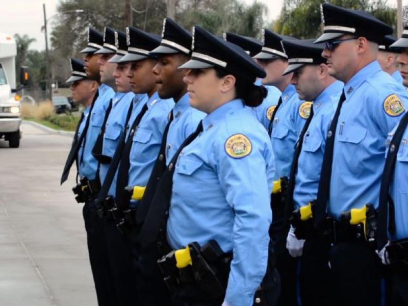 New Orleans Police Department officers stand at attention