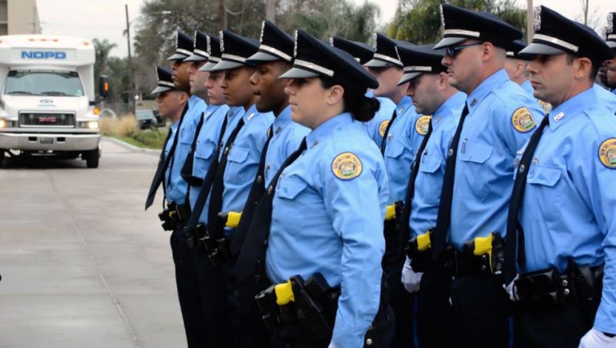 New Orleans Police Department officers stand at attention