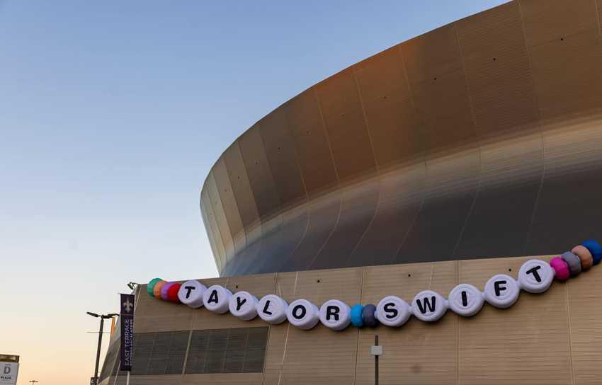 exterior of New Orleans Superdome with Taylor Swift banner