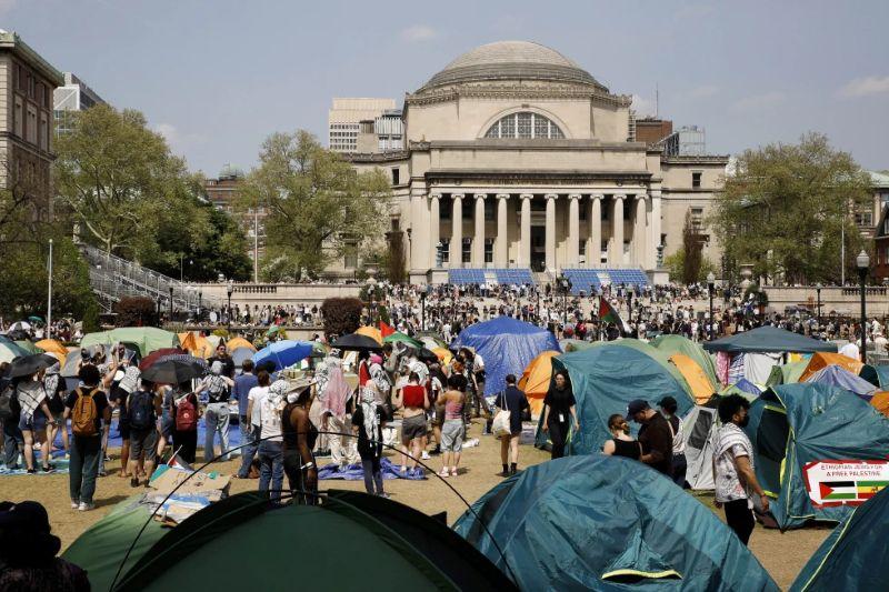 Student protesters gather inside their encampment on the Columbia University campus, April 29, 2024, in New York