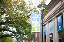 Bookfest banner in front of Dixon Hall on Tulane's Campus