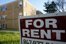 For rent sign in front of an apartment building