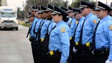 New Orleans Police Department officers stand at attention