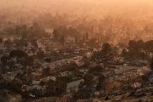 smoke lingers over a neighborhood in Altadena California