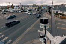 vehicles and traffic shown at an intersection